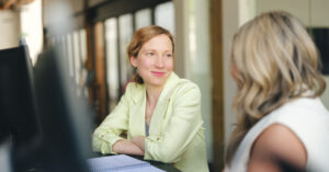 Kinesian and client collaborating at a desk