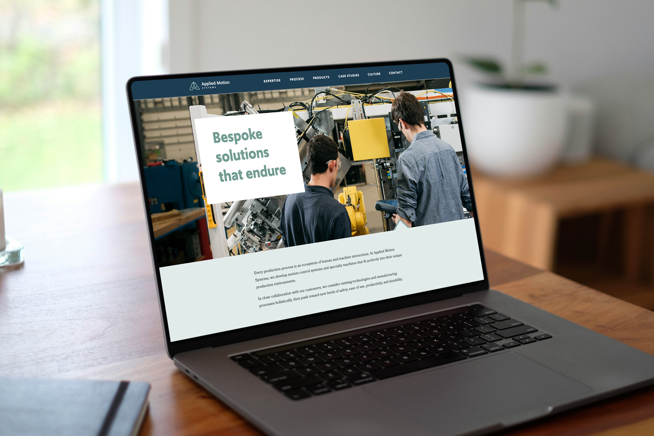 Applied Motion Systems website on a laptop screen